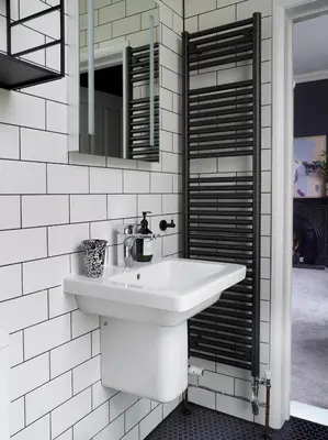 a white bathroom with a sink and a mirror at The Royston in Llanbrynmair