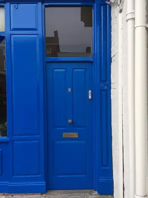a blue door in front of a building at Flat G, 8 Castle Street in Ludlow