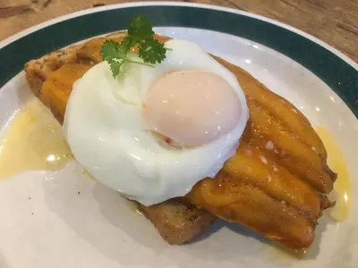 a fried egg on top of some food on a plate at Highland Moors in Llandrindod Wells