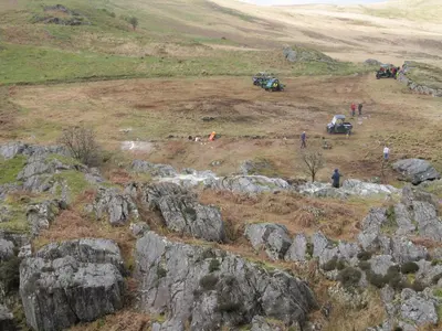 a group of people standing on top of a hill at Highland Moors in Llandrindod Wells
