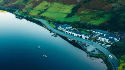 an aerial view of a bridge over a body of water at Tynycornel Hotel in Tal-y-llyn