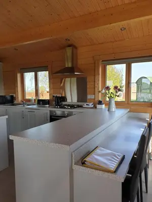 a kitchen with a large counter top in a cabin at Ruth's Retreat Beautiful Country Retreat with private hot tub & wonderful views in Shrewsbury