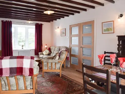 a living room with a couch and a table at Glasfor in Llanon
