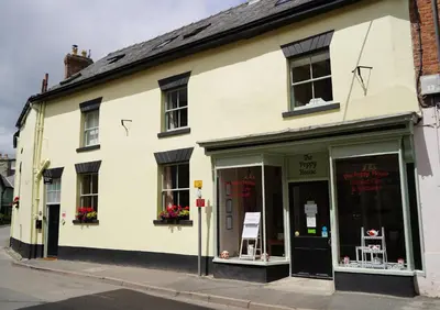 a white building on the corner of a street at The Poppy House in Bishops Castle