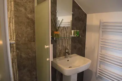 a bathroom with a sink and a shower at Borthwenbnb in Dolgellau