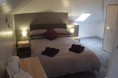 a bedroom with a bed with two hearts on it at Borthwenbnb in Dolgellau