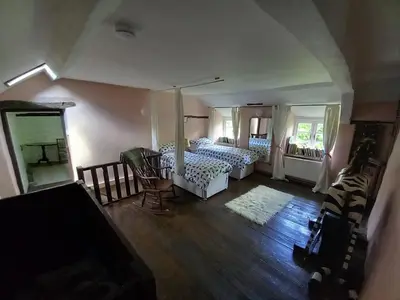 an aerial view of a bedroom with two beds at Gesail Barn and Farmhouse in Machynlleth