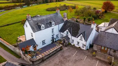 an aerial view of a large white house at Ty Newydd B&B in Brecon