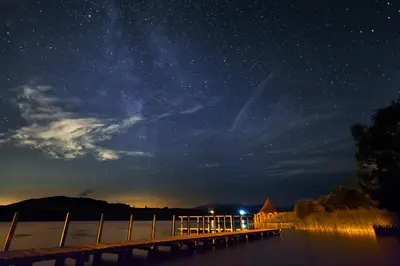 a starry night with a dock and the milky way at Ty Newydd B&B in Brecon