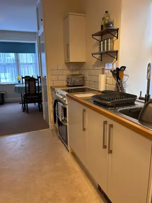 a kitchen with a sink and a stove top oven at 2 Bell Street in Talgarth