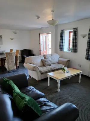 a living room with a couch and a coffee table at The Stores in Aberystwyth