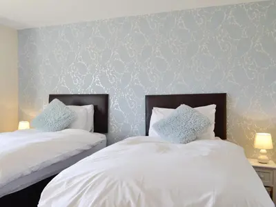 two beds sitting next to each other in a bedroom at Upper Close - Uk10873 in Evenjobb