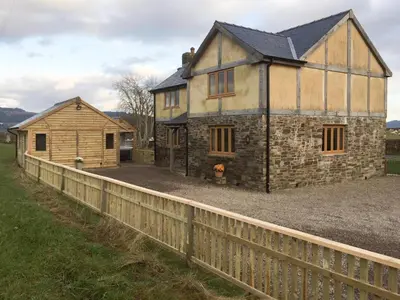 an old house with a fence in front of it at Upper Close - Uk10873 in Evenjobb