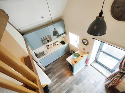 an overhead view of a living room with a desk at Captains Lookout (Studio apartment) in Brecon