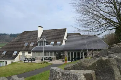a house with solar panels on its roof at Neuadd Henllan Lodge in Builth Wells