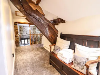 a bedroom with a bed in a room at Cwm Yr Afon Mawr in Llanbedr
