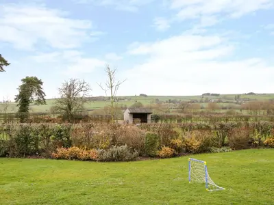 a metal object in the middle of a field at Southdown in Much Wenlock