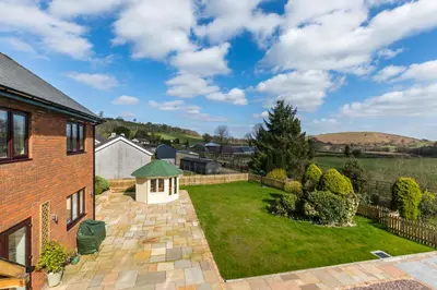 an image of the garden of a house at Woodland View Holiday Apartment in Llanwrda