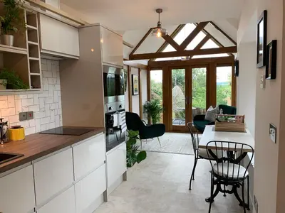 a kitchen and dining room with a table and chairs at The Folly in Ludlow
