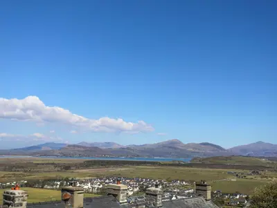 a view from the observatory of the city and mountains at Harlech Apartments - Branwen in Harlech