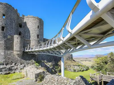 a bridge in front of a castle at Harlech Apartments - Bendigeidfran in Harlech
