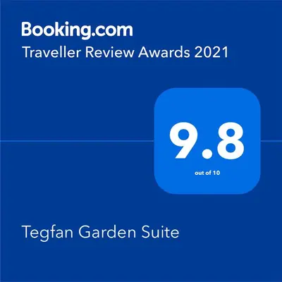 a screenshot of a teslin garden suite with the text travelling review awards at Tegfan Garden Suite in Talgarth
