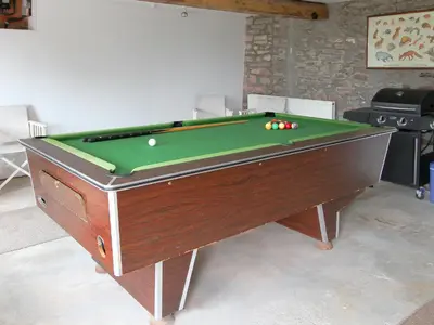 a pool table with balls on top of it at Woodland View-Uk11826 in Llandefaelogfâch