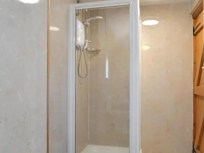 a shower with a glass door in a bathroom at Mountain View-Uk11825 in Llandefaelogfâch