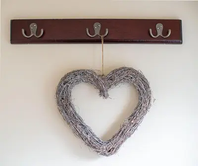 a heart shaped wreath hanging on a wall at Magnolia Cottage in Church Stretton