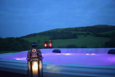 a group of lights on a patio at night at Healing Pastures Farm in Llanbrynmair