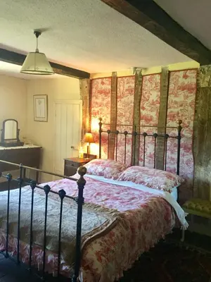 a bedroom with a bed in a room at Lower House Farm B&B, Herefordshire in Hergest