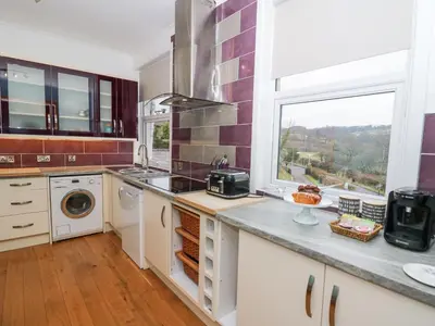 a kitchen with a sink and a window at Ty'r Orsaf in Builth Wells