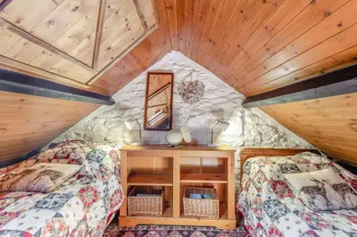 a room with two beds in a tree house at 2 Bed in Llandeilo oc-waw313 in Talley