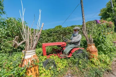 a statue of a man sitting on a tractor at 2 Bed in Llandeilo oc-waw313 in Talley