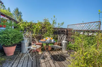 a patio with a table and chairs in a garden at 2 Bed in Llandeilo oc-waw313 in Talley