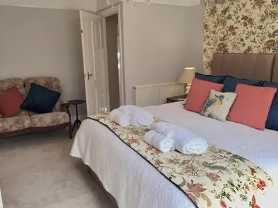 a bedroom with a bed with towels on it at Bron Hafren in Montgomery