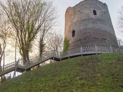 a large castle on top of a grassy hill at Penmaen in Talgarth