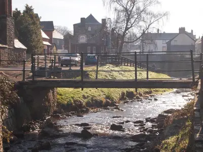 a bridge over a river with cars on a road at Penmaen in Talgarth