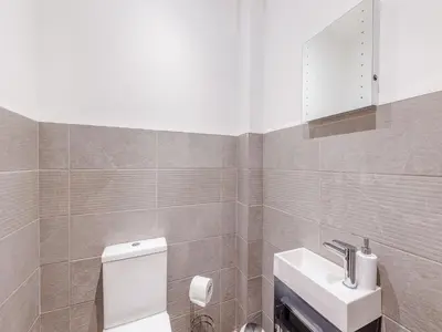 a bathroom with a white toilet and a sink at Ty Felin - Uk12744 in Acrefair