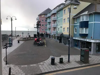an empty street with buildings on the beach at 1 Lisburne House in Aberystwyth