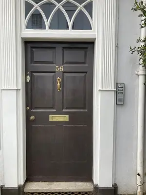 a black door with the number on it at Assembly View - two bedroomed apartment with parking permit in Ludlow Town Centre in Ludlow