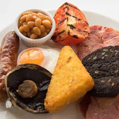 a plate of food with eggs mushrooms and other foods at Starling Cloud in Aberystwyth