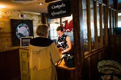 two women standing at a counter in a restaurant at Starling Cloud in Aberystwyth
