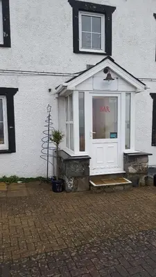 a bank sign in the window of a building at Hendre Coed Isaf static caravan Barmouth in Barmouth