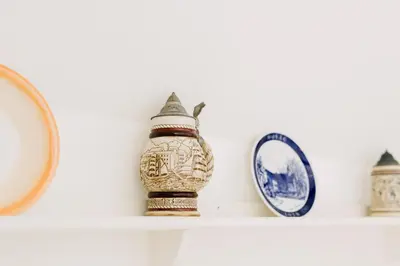 a shelf with a vase and plates on it at The Stable at Ty Beic in Bala