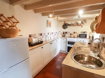 a kitchen with a sink and a counter top at Plas Arenig in Blaenau-Ffestiniog