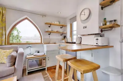 a kitchen and living room in a tiny house at The Folly in Hereford