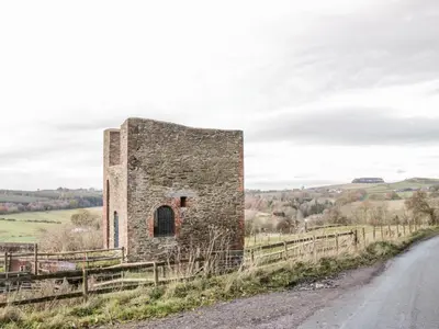 an old stone building on the side of a road at Stiperstones View in Shrewsbury