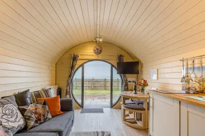 a living room and kitchen in a tiny house at Corndon Pod in Shrewsbury