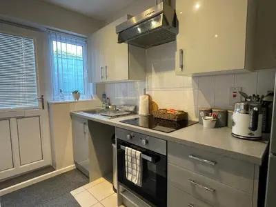 a kitchen with a sink and a stove top oven at Westend Holiday Let 2 Brecon in Brecon